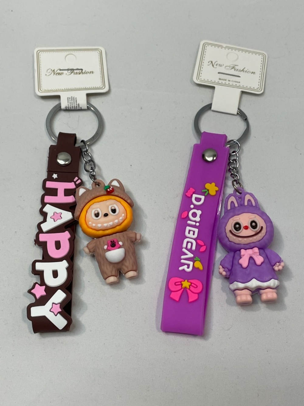Lafufu Monster Character Keychain Duo - Purple and Brown